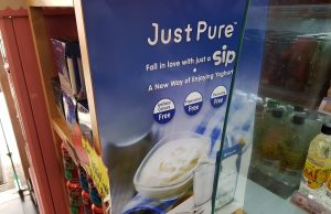 Mengniu Just Pure yogurt lists its official distributors on the new export pack