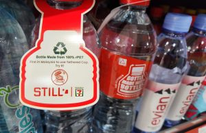 7-Eleven sells new eco-friendly bottled water featuring tethered cap and 100% rPET